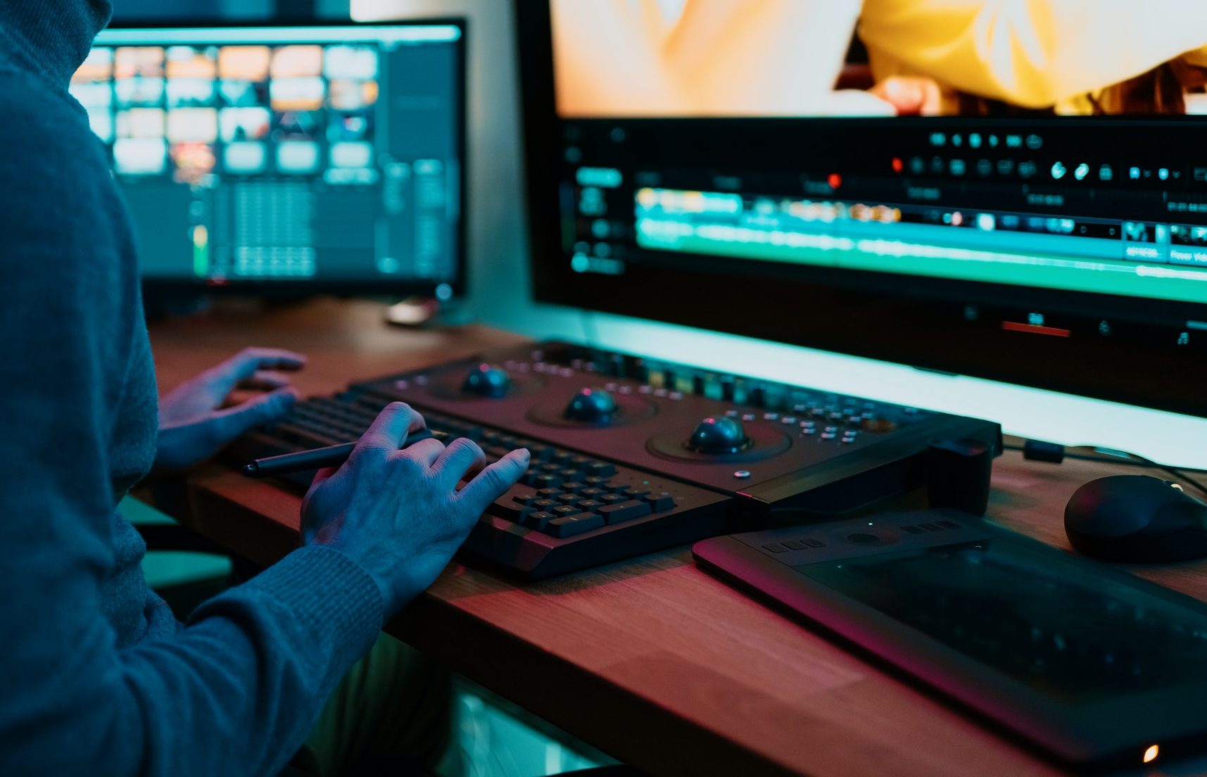 Male Video Editor Working on His Personal Computer with Big Display